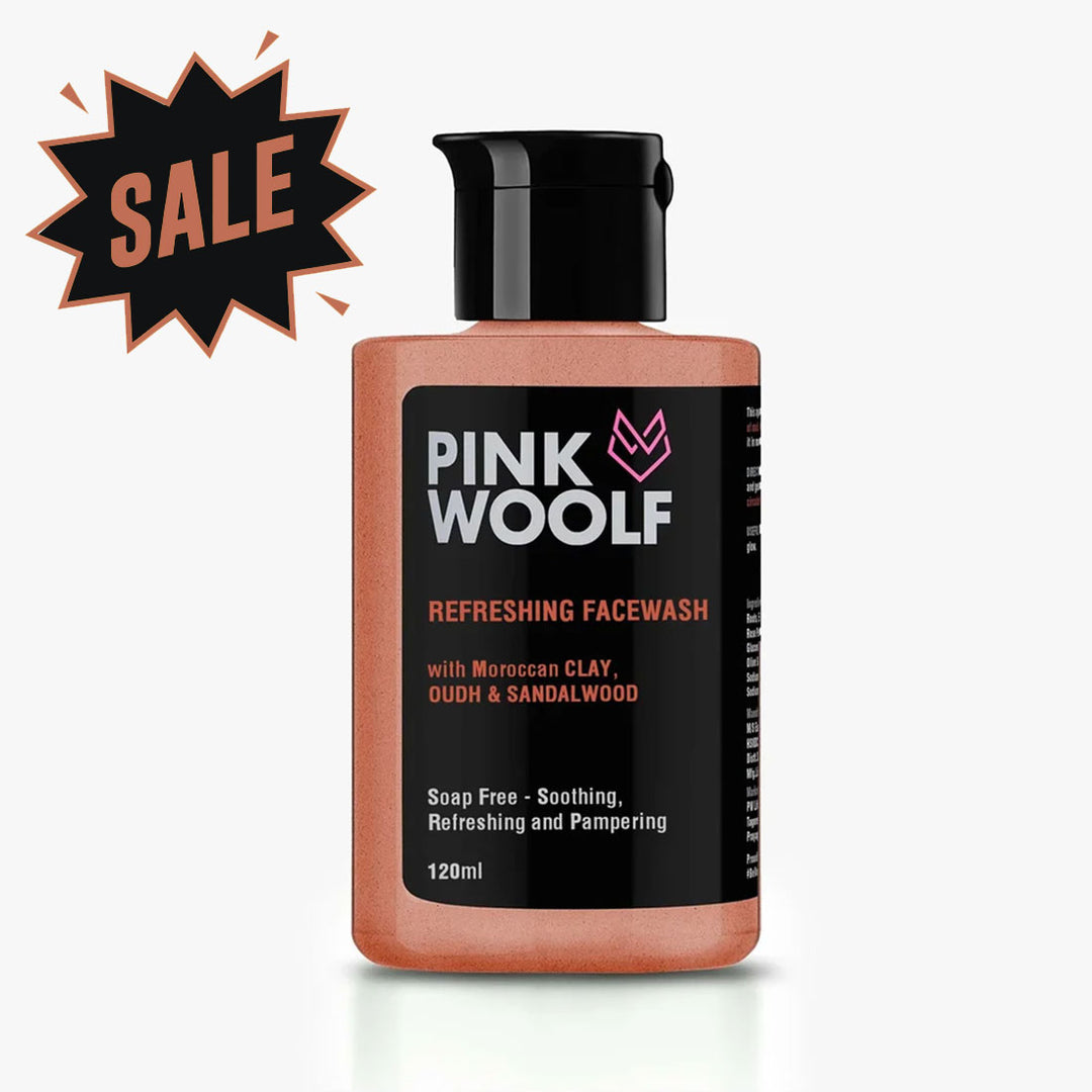 A bottle of Pink Wolf Refreshing Facewash with Moroccan Clay, Oudh & Sandalwood, shown on a light gray background with a black and orange 'SALE' starburst graphic in the top left corner.