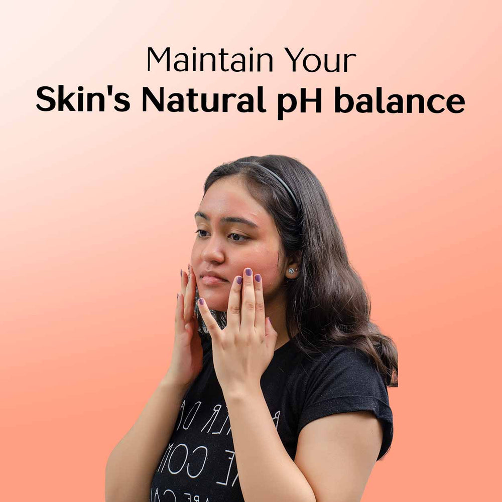 A woman applying face wash to maintain the skin's natural pH balance