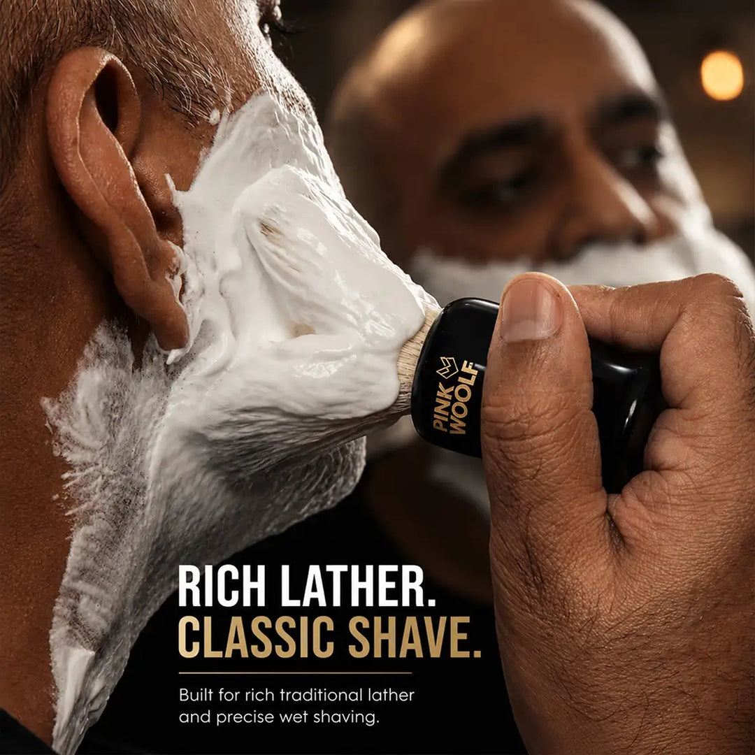 Pink Woolf boar bristle shaving brush applying rich lather during traditional wet shaving