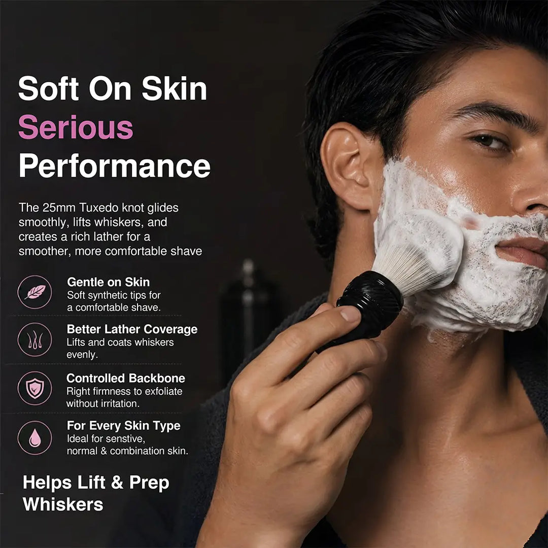 A man with white shaving foam on his face uses a black-handled facial cleansing brush against his cheek. The image includes marketing text on the left describing soft-on-skin performance and benefits, with a dark studio background.